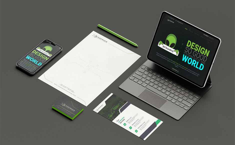 Mobile device and tablet displaying business website, alongside letterhead, business cards, and brochure for branding services by Koerner Creations