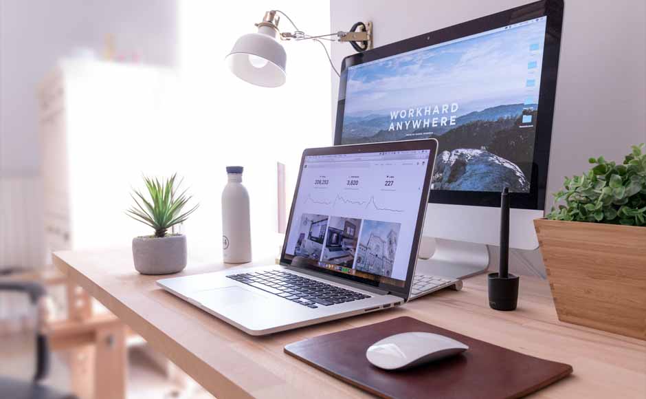 Laptop and desktop computer displaying business website for web design services by Koerner Creations
